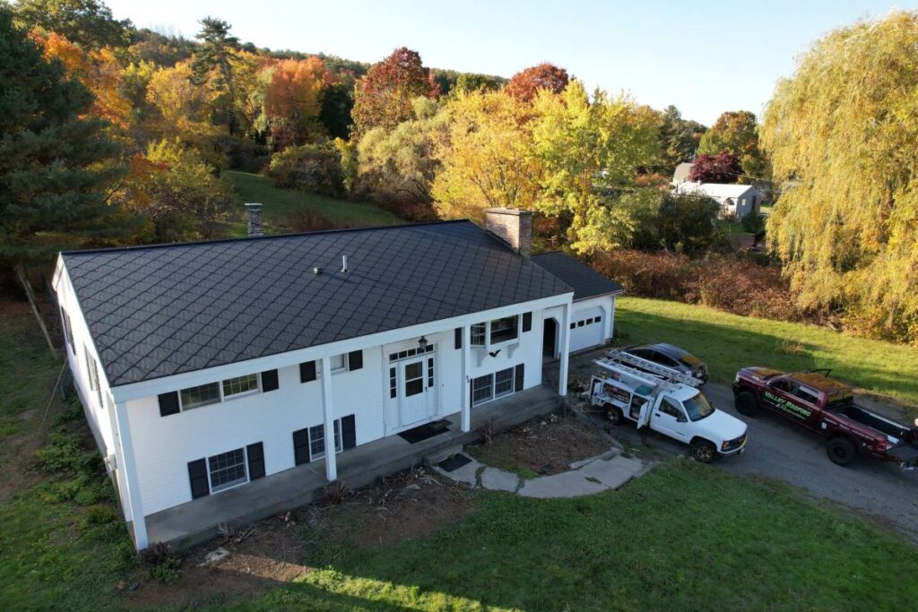 Valley Roofing and Restoration big white house grey tiles