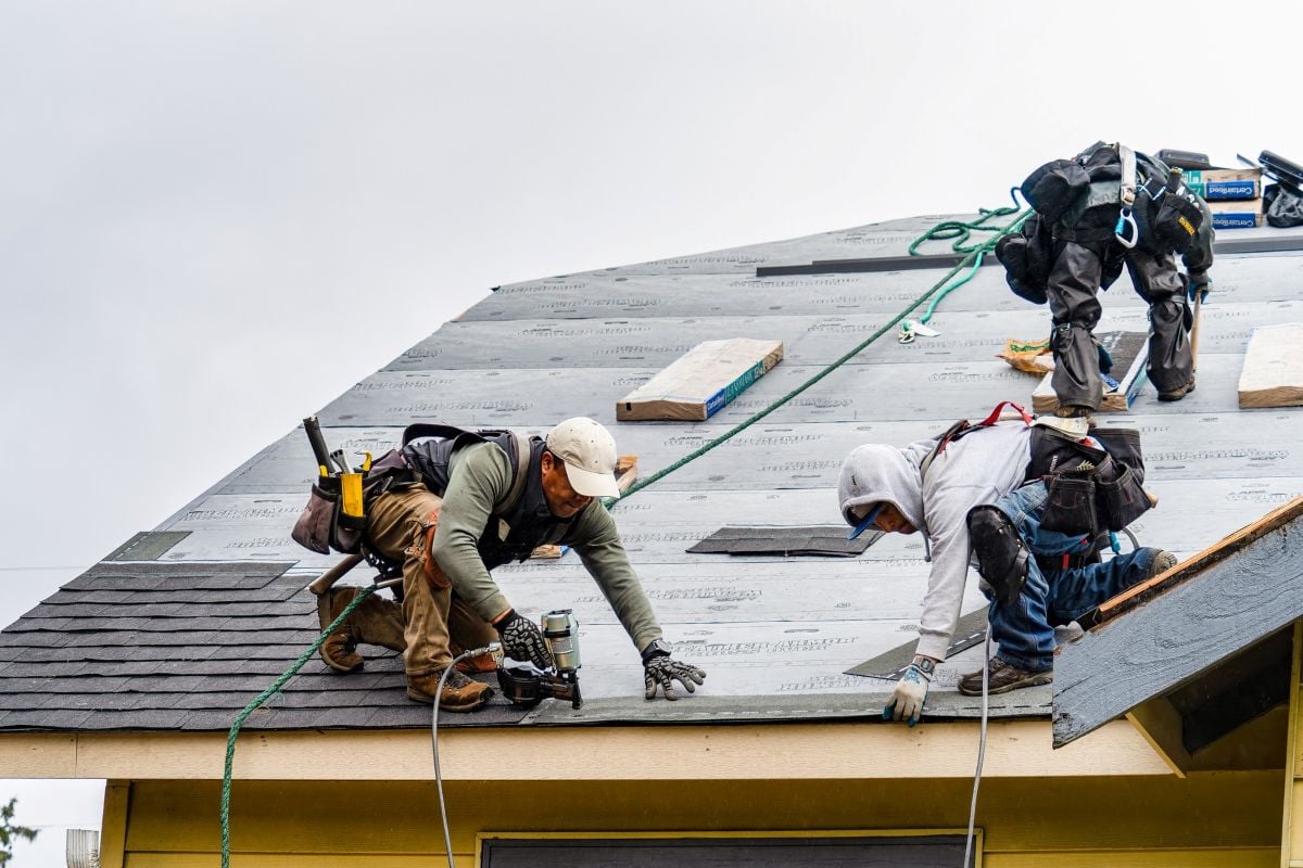 Valley Roofing and Restoration workers installing new roof