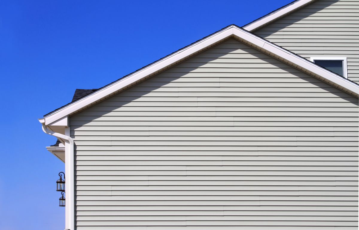 beige sidings window and white roof