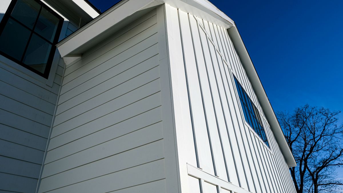 white siding blue sky